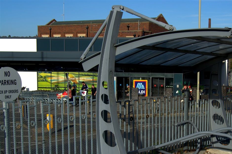 Bike shed and fencing surrounding Travelodge KFC, designed and constructed by IHS