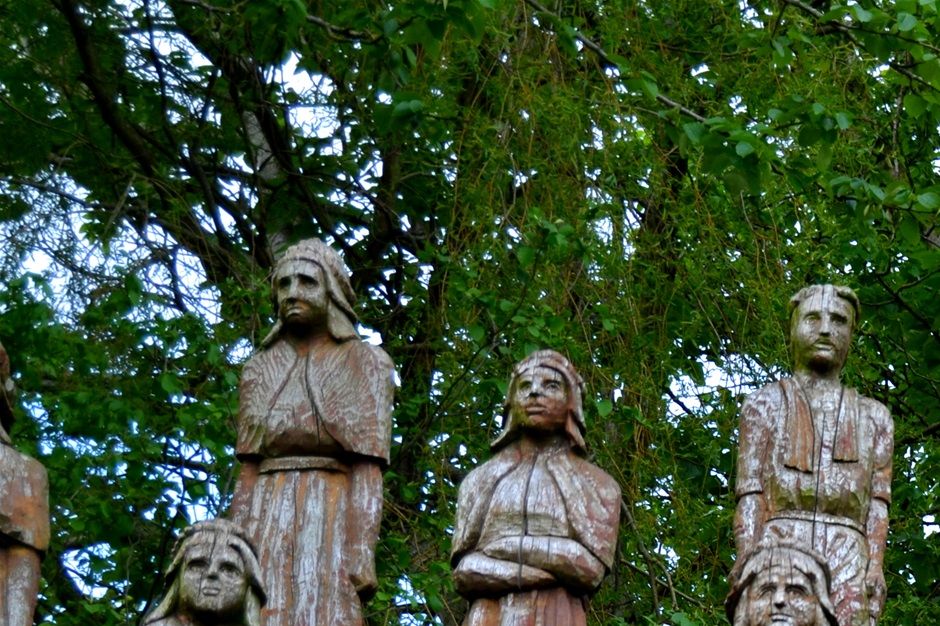 Oxford st Roundabout . Chestnut Totem poles.  Carved by Robert Koenig