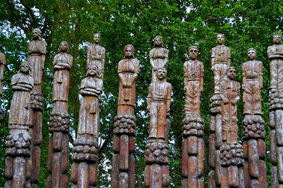 Oxford st Roundabout . Chestnut Totem poles.  Carved by Robert Koenig