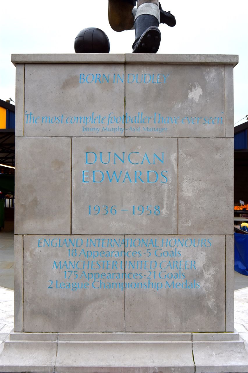 Market place, Duncan Edwards, designed by James Butler in bronze, patinated. Mike Davis Foundry. Plinth designed by Steve Field, inscribed by Malcom Sier